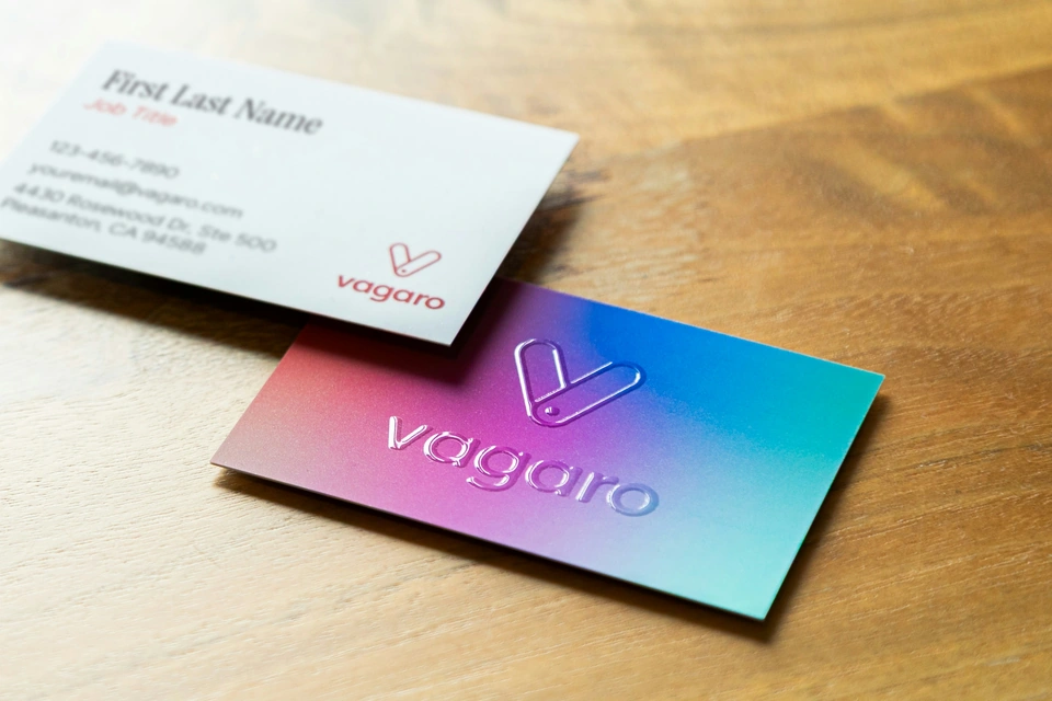 Two business cards on a wooden surface — stock style reference