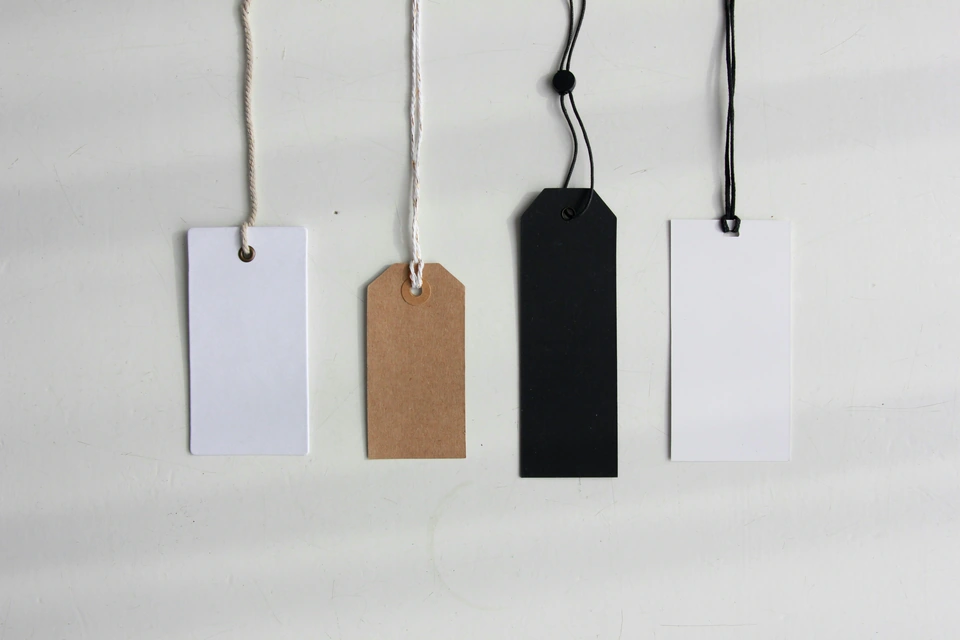 four paper card tags — stock style reference